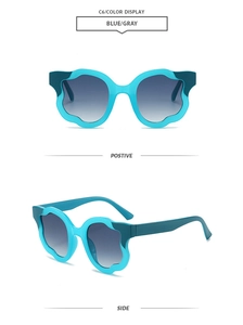 Detail view of flower-shaped children's sunglasses in blue and gray from multiple angles