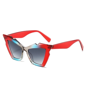 Retro geometric cat-eye sunglasses with red and blue gradient frames and gray lenses