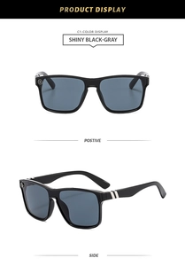 Close-up of shiny black punk sunglasses featuring a power symbol on the side frame