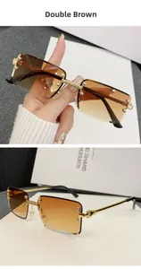 Close-up of rimless square sunglasses with brown gradient lenses and gold embossed metal arms