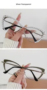 Detailed view of silver cat-eye frames featuring elegant pearl embellishments and clear lenses