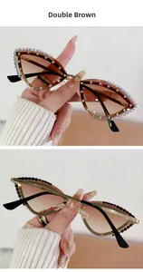 Close-up of cat-eye sunglasses featuring rhinestones and brown gradient lenses