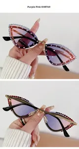 Close-up of cat-eye sunglasses with purple-pink gradient lenses and rhinestone trim