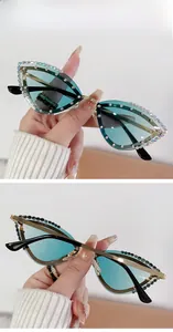 Detail view of double green cat eye sunglasses with rhinestones and JG139 model marking