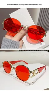 Close-up of retro oval sunglasses with gold metal frame and red lenses for fashion street style