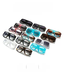 Flat lay of multiple stylish oversized sunglasses in various colors and trendy leopard prints