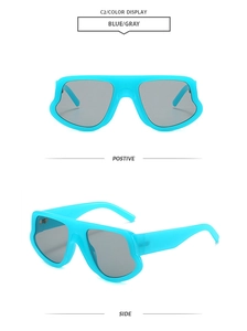 Close-up of sky blue irregular chunky sunglasses with dark gray lenses and wide temples