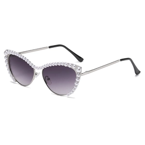 Fashionable cat eye sunglasses with silver metal frame and pearl accents and purple lenses