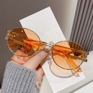 Vintage oval sunglasses with gold metal frame and orange lenses for stylish sun protection