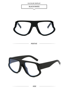 Detail view of large oversized black frames with reflective blue lenses in a modern style