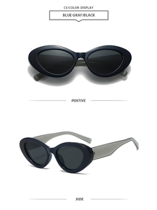 Detail view of cat eye sunglasses with dark blue frames and sleek black lenses