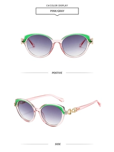 Lunettes de soleil œil-de-chat roses avec touches vertes et détails dorés