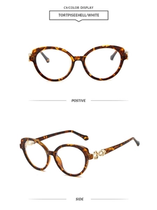 Détails de lunettes de soleil œil-de-chat écaillées avec branches décoratives dorées