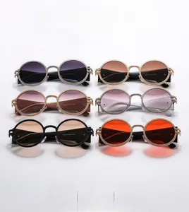 Collection of vintage oval sunglasses with textured glitter frames in multiple colors