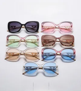 Detail of trendy cat eye sunglasses featuring heart-shaped metal lens decorations