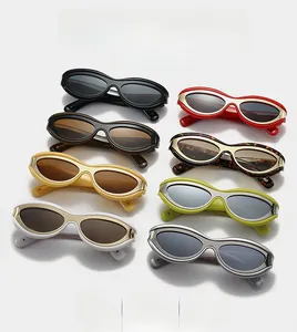 Flat lay of retro oval cat eye sunglasses in various colors with silver metal trim