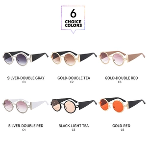 Multi-color oval sunglasses display with detailed wide frames and gradient lenses