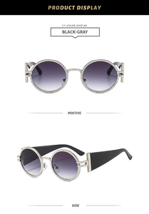 Detail of retro oval sunglasses featuring silver metal frames and wide black temples