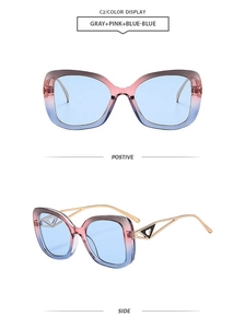 Detail of gradient frames with blue lenses and golden hollow heart metal temples