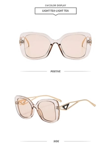 Detail view of light tea lenses and gold metal temples with heart motif decoration