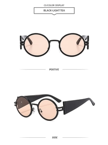 Front and side views of vintage oval black sunglasses with light tea lenses and wide temples