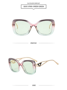 Detail of gradient cat-eye sunglasses with gold metal temples and hollow heart design