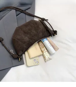 Interior view showing the spacious capacity of this retro crescent crossbody shoulder bag
