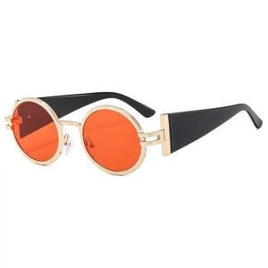 Vintage oval sunglasses with orange lenses, gold textured frames and wide black temples