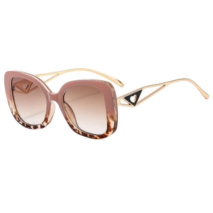 Retro cat-eye sunglasses with gradient brown lenses and ornate gold hollow temples