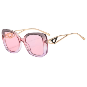 Retro cat-eye sunglasses with transparent pink frame and gradient pink lenses on white background