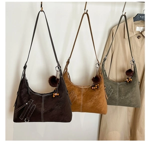 Detailed display of three hobo shoulder bags in brown, khaki, and olive green colors