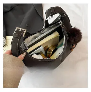 Detailed interior view of a large brown leather tote bag showing spacious storage capacity