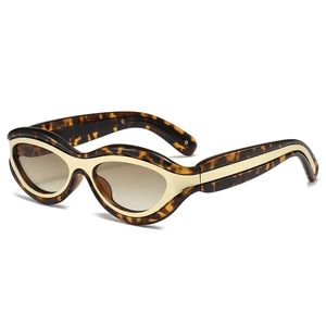 Retro tortoiseshell cat-eye sunglasses with gold metal accents and brown gradient lenses