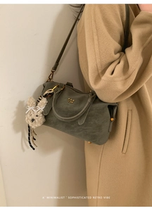 Sage green Boston bag with litchi texture and cute plush bunny pendant detail