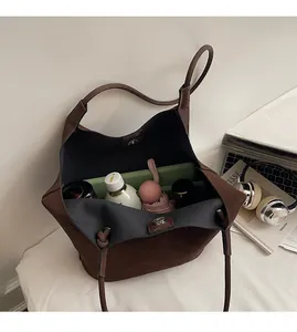 Top-down view of woven tote bag interior showing large capacity for laptop and daily items