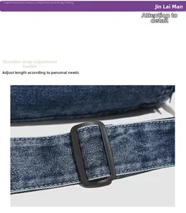 Detail of adjustable black strap buckle on durable blue denim messenger bag