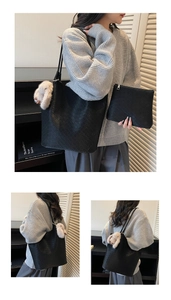 Detail of black woven leather tote bag with small zipper pouch and plush rabbit charm