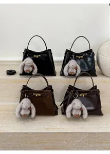 Detail view of vintage bucket bags in matte and smooth leather with metal buckles