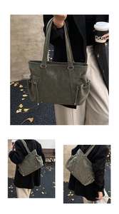 Vista detallada del bolso tote de cuero verde oscuro con cordón vintage y aros de metal