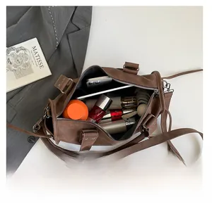 Internal view of brown vintage tote bag showing large capacity for daily essentials