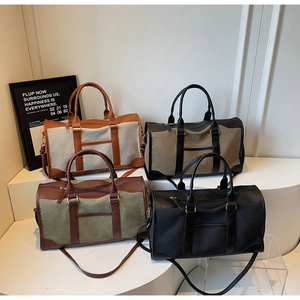 Detail view of large canvas tote bags in four color combinations on display stands