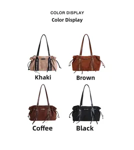Detail view of large faux suede tote bags in four colors with metal logo and zipper