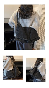 Detailed views of a large black vintage tote bag with buckle accents and matte texture