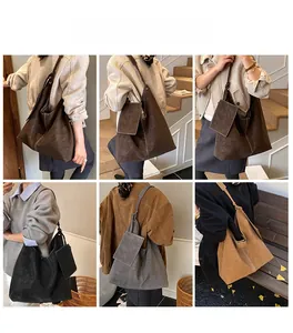 Détail du grand sac cabas en cuir mat avec bandoulière nouée et pochette assortie