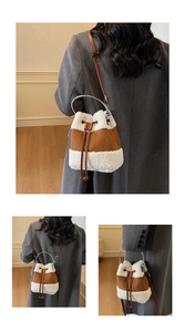 Detail of plush suede bucket bag featuring metal ring handles and leather drawstring