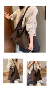Détail du grand sac cabas en daim marron foncé avec surpiqûres et bandoulière nouée