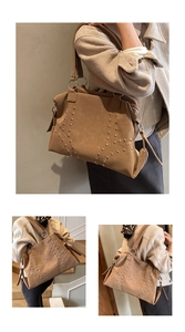 Close-up of vintage tan PU leather tote featuring silver rivets and large capacity