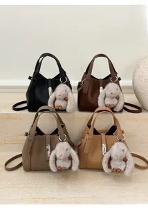 Litchi pattern leather handbags in four colors with cute plush rabbit pendants