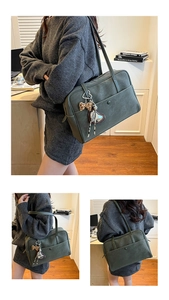 Detail of dark green vintage tote bag featuring a leopard bow and silver heart charm