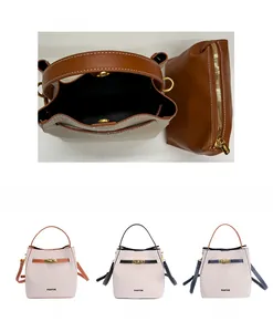 Detail view of canvas bucket bag interior structure and detachable zipper pouch inserts